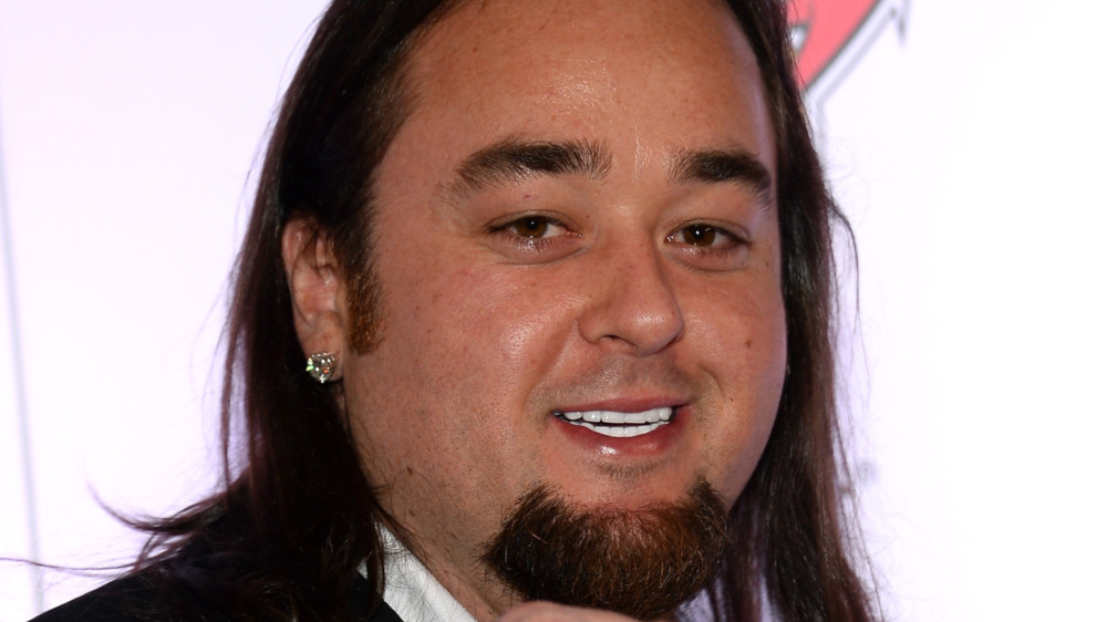 Austin Chumlee Russell smiling long hair