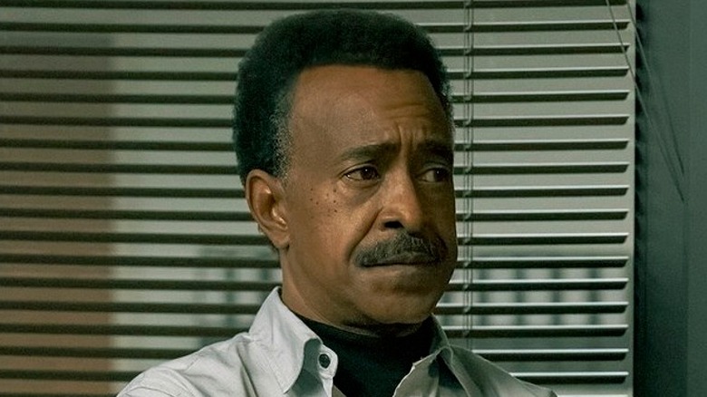Langston Fleury crossing his arms in Peacemaker Season 2