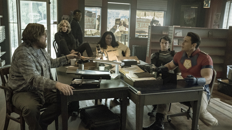 Steve Agee, Jennifer Holland, Chukwudi Iwuji, Danielle Brooks, Freddie Stroma and John Cena sitting together in "Peacemaker" 