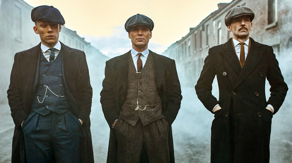 Tommy, Arthur, and John Shelby stand intimidatingly