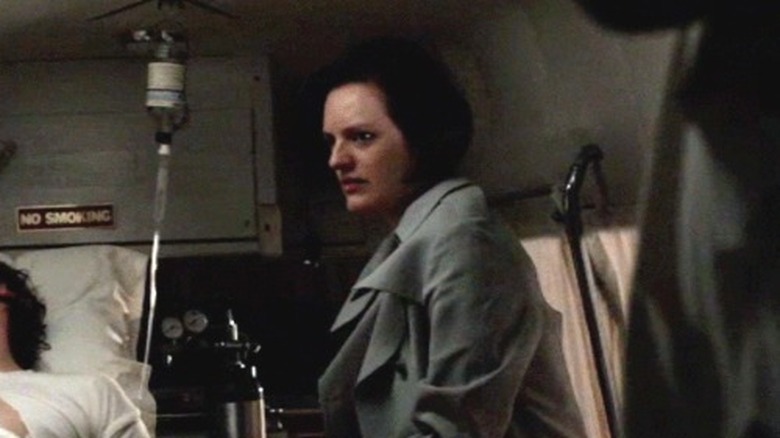 Abe and Peggy ride in ambulance