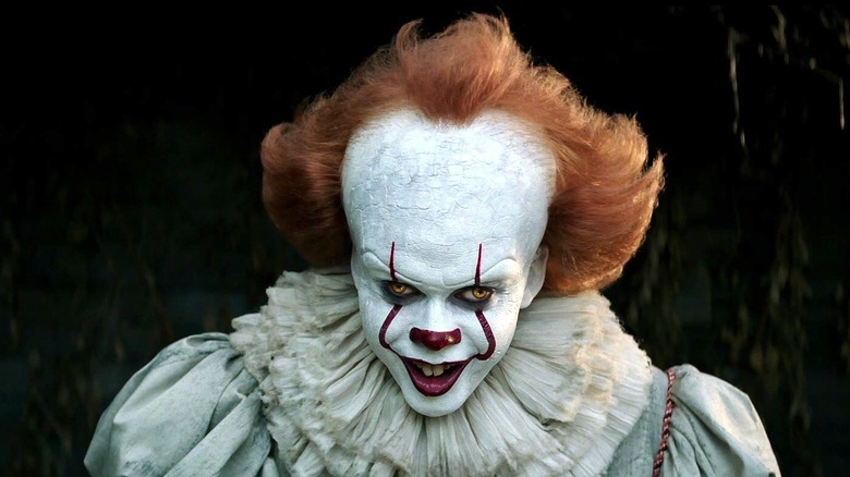 Bill Skarsgård's Pennywise the Dancing Clown smiling in It