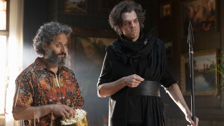 Mr. D and Tantalus look unconvinced in Percy Jackson and the Olympians