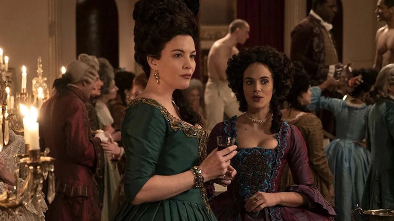 Lady Isabella (Liv Tyler) and Charlotte mingling together at a party rife with mild ribaldry