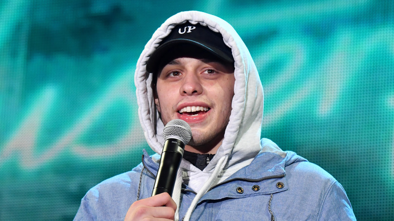 Pete Davidson speaking into microphone