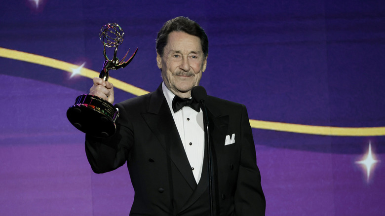 Peter Cullen holding an Emmy