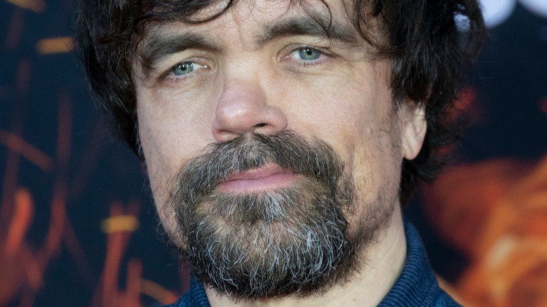 Peter Dinklage at event smiling