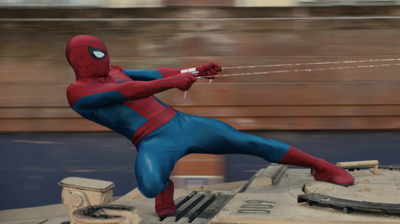 Spider-Man using his web shooters and pulling on the webs in Spider-Man: Brand New Day