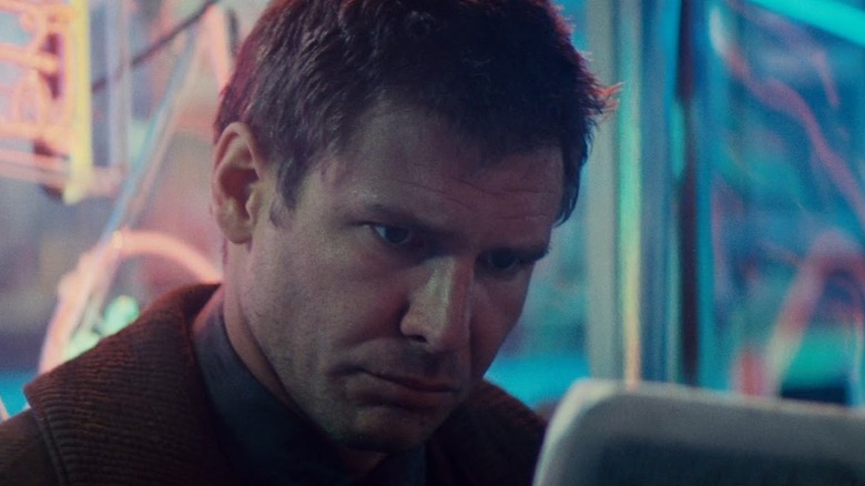 Rick Deckard looking at a screen in Blade Runner