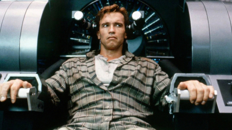 Douglas Quaid looking freaked out in a chair in Total Recall
