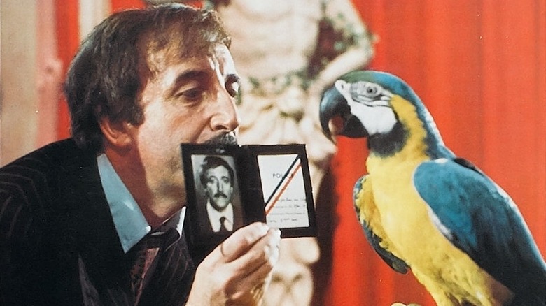 Inspector Jacques Clouseau shows off his badge to a parrot in "The Pink Panther Strikes Again" (1976)