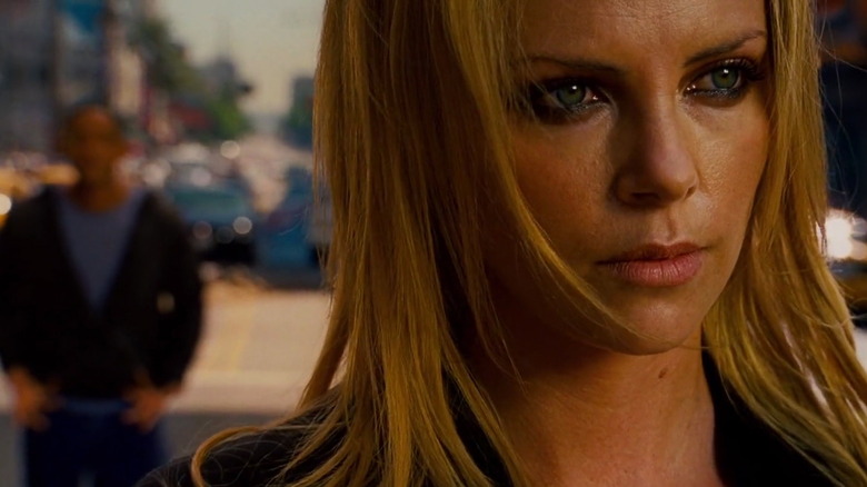Mary looks into the distance while Hancock stands far behind her in Hancock (2008)