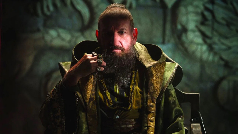 The Mandarin twirls his beard in Iron Man 3 (2013)