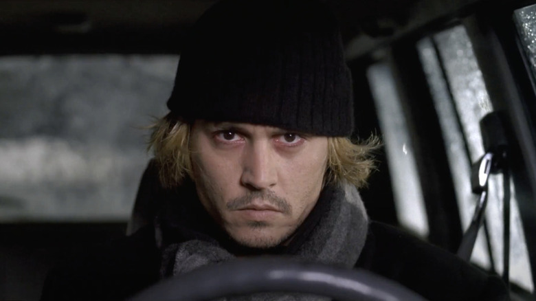 Morts sits in a car, looking intensely ahead in Secret Window (2004)