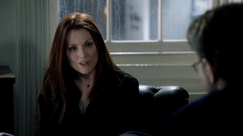 Telly Paretta leans forward, speaking, in The Forgotten (2004)