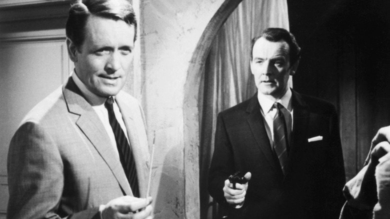 A man pointing a gun at Drake in Danger Man (1960)