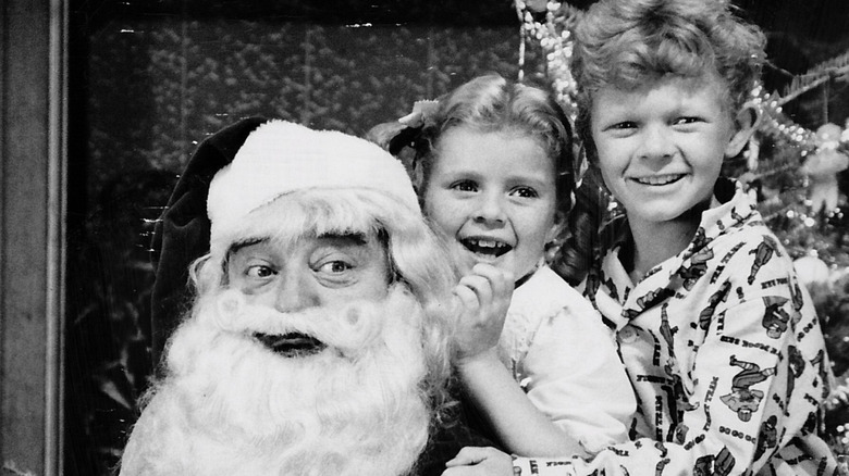 Buffy and Jody smiling with Santa in Family Affair (1966)