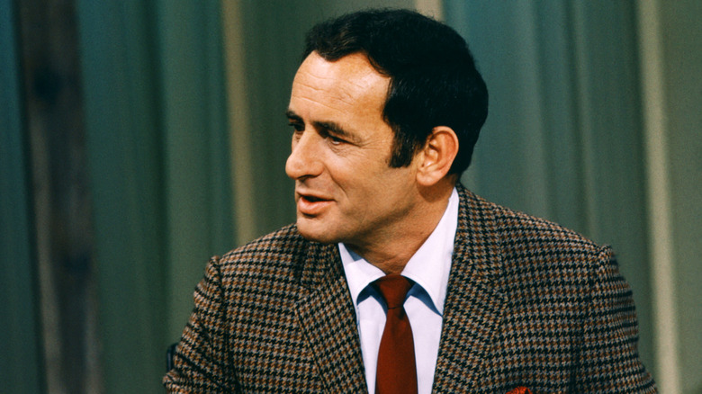 Joey Bishop talking with a guest while taping "The Joey Bishop Show" (1967)