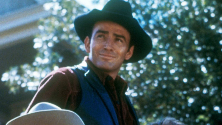 The Virginian smiles in a black hat in The Virginian (1962)