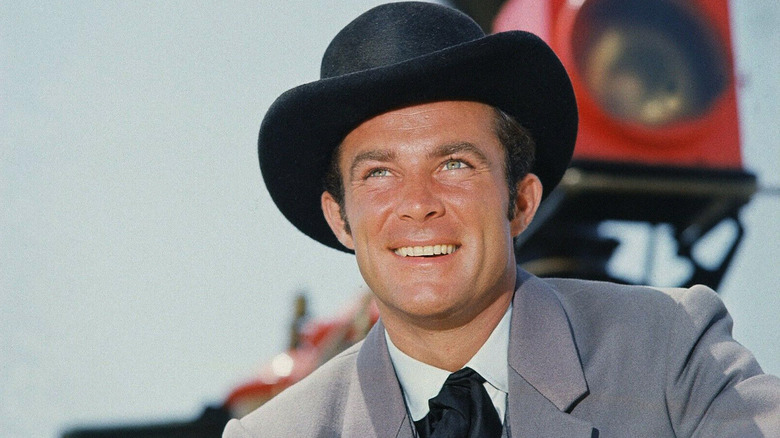 Jim West looking off and smiling in The Wild Wild West