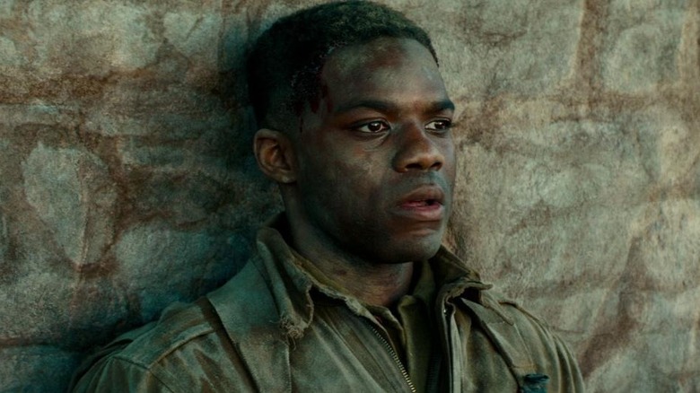 Private Boyce backed against wall in Overlord
