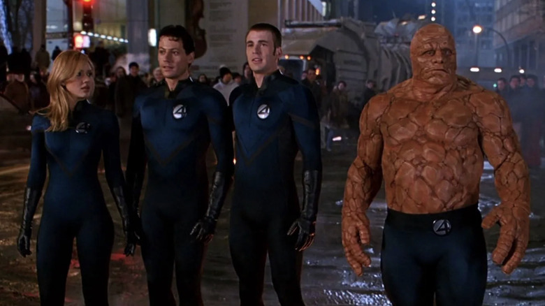 The Fantastic Four standing together after saving the day (2005)