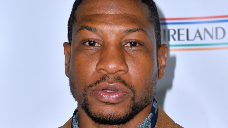 Jonathan Majors looking upward