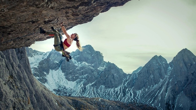 Naomi Cooper scaling a mountain in Cliffhanger (2027)