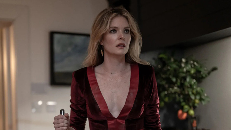 Violet looking shocked in a low cut dress in Drop