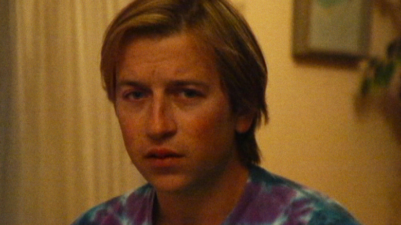 Dan Plumb looking nervous and staring into a camera in Primetime (2026)