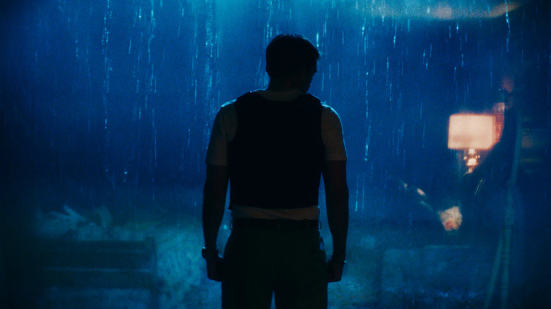 Chris Hansen standing in the pouring rain, clenching his fists, in Primetime (2026)