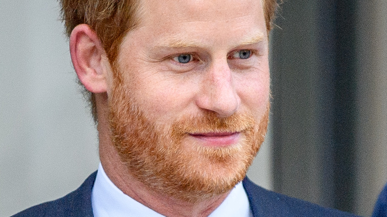 Prince Harry smirking at the paparazzi 