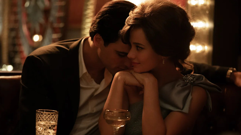 Elvis kisses Priscilla's shoulder