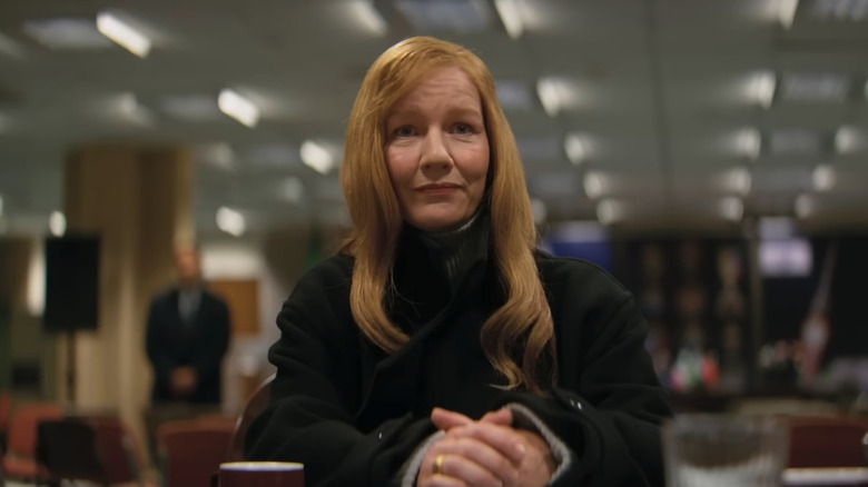 A close up of Stratt sitting at a desk in Project Hail Mary