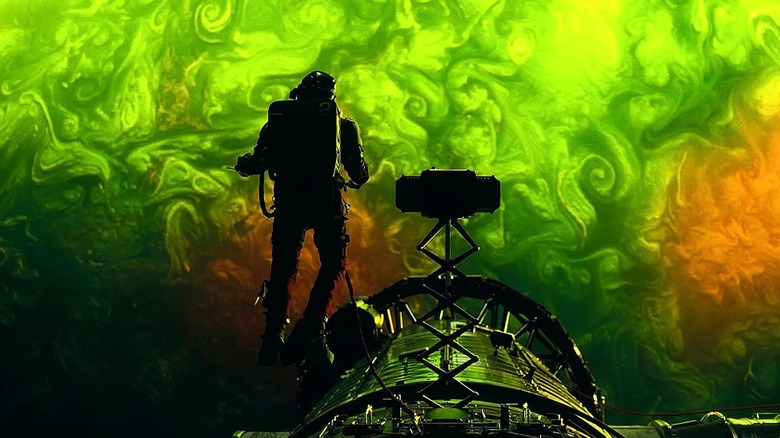 Grace in space above Adrian in Project Hail Mary