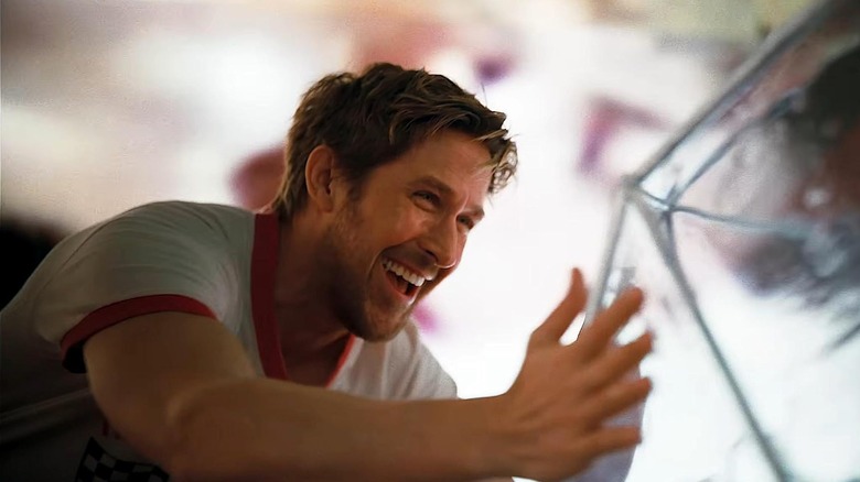 Ryland laughs and looks at Rocky in Project Hail Mary