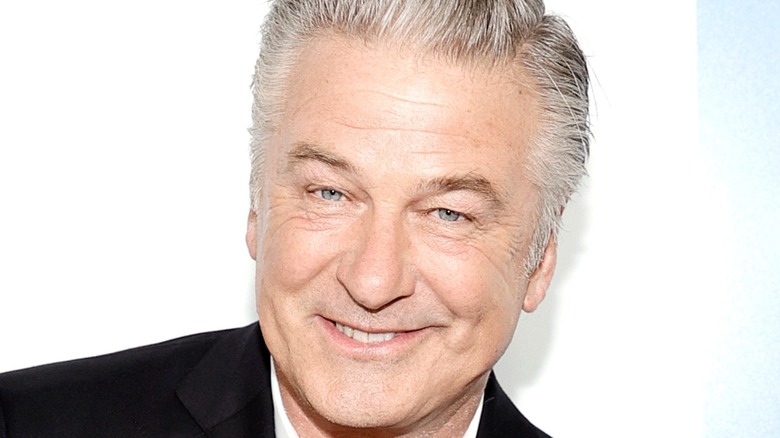 Alec Baldwin smiling for photographers