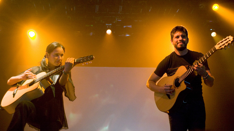 Gabriela and Rodrigo play guitar