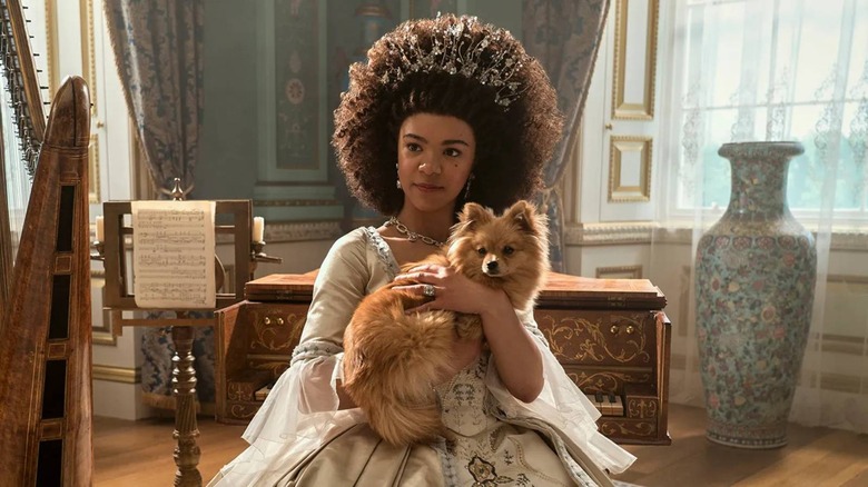 Queen Charlotte holding dog