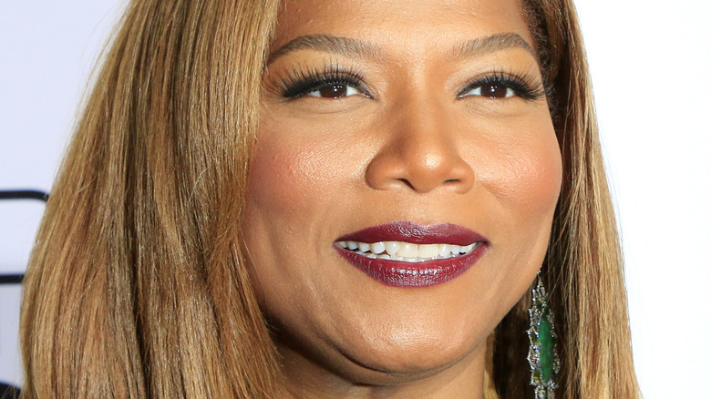 Queen Latifah smiles