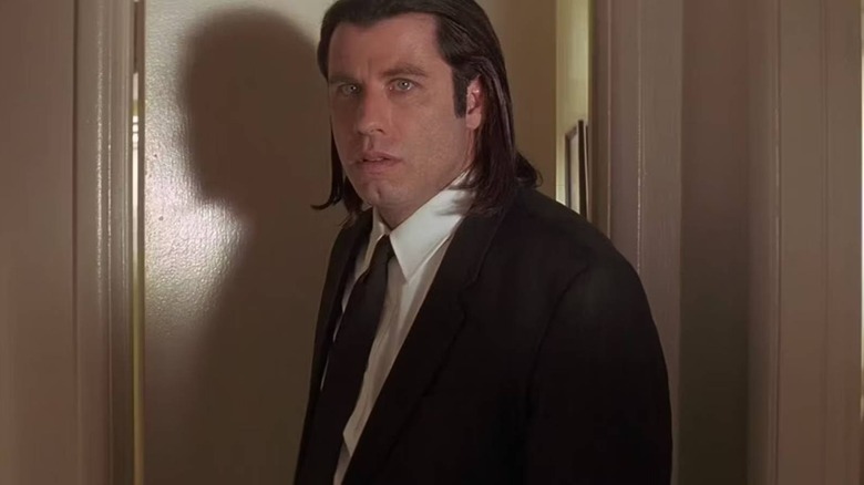 Vincent Vega coming through door