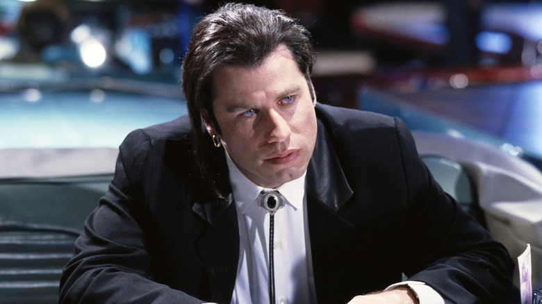 Vince listening to Mia in the diner in Pulp Fiction (1994)