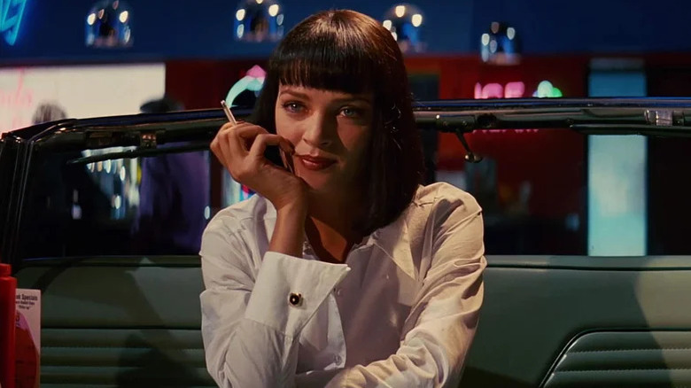 Mia Wallace smoking at a diner table in Pulp Fiction (1994)