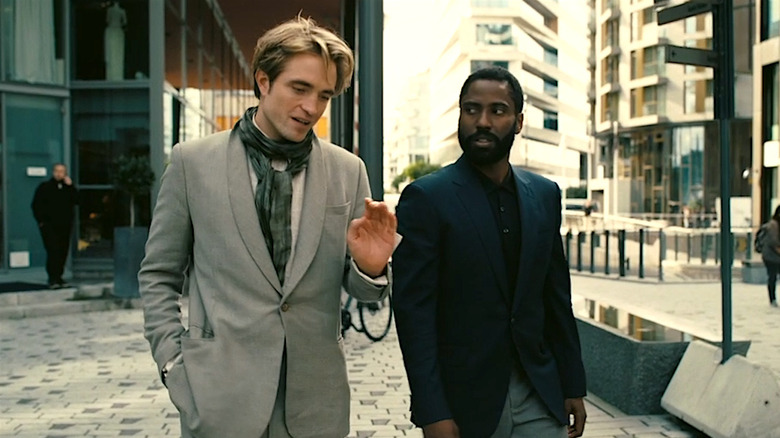 Neil and the Protagonist talking on the street in Tenet