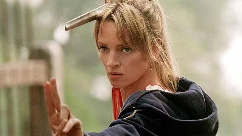 Beatrix, The Bride, poses with a practice sword in Kill Bill: Volume 1 (2003)