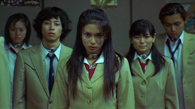 Several students, led by Takako, in Battle Royale (2000)
