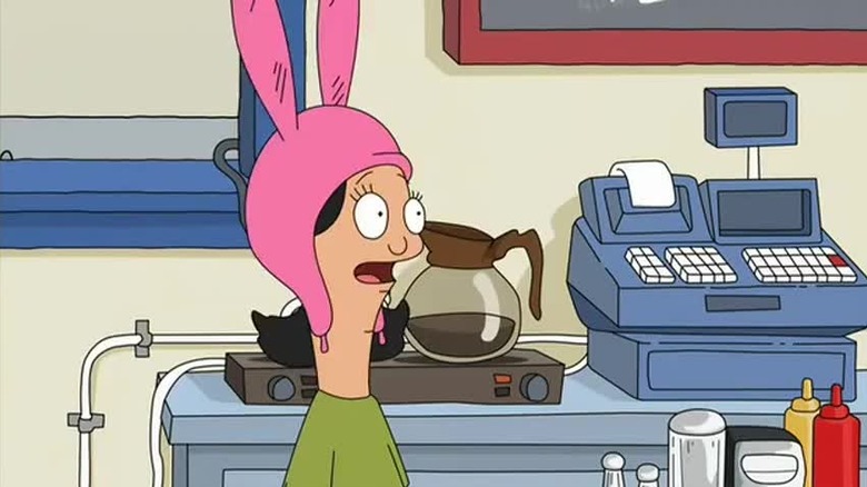 Louise behind the counter in episode one
