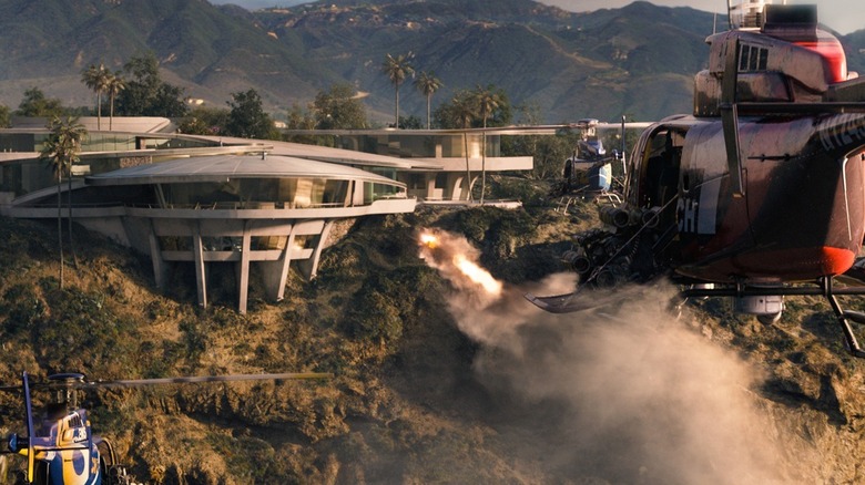 The Mandarin's helicopters fire missiles at Tony Stark's house