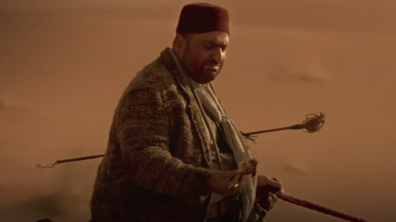 Warden Gad Hassan rides camel- Imhotep