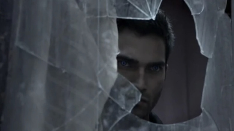 Derek peering through broken window